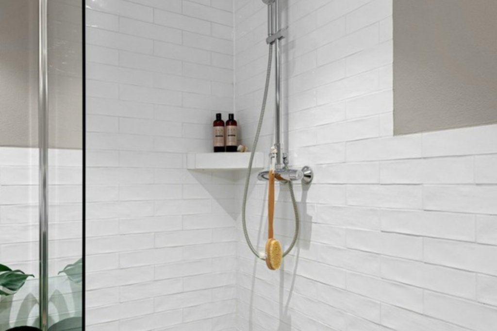 Bright white tiled shower
